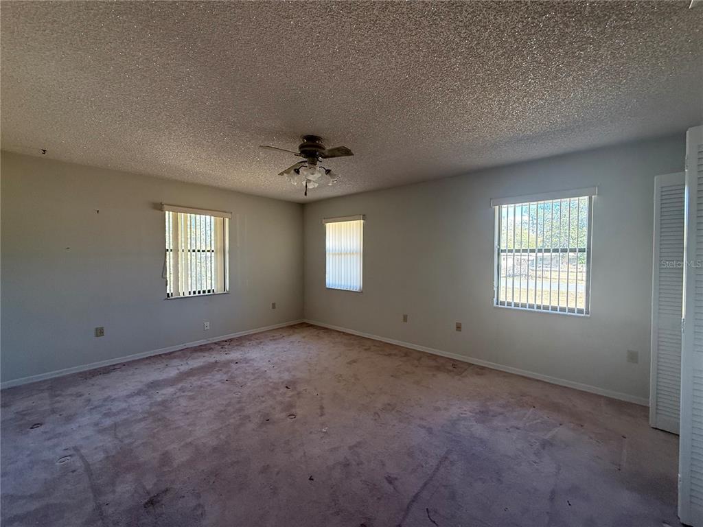 34847 Learn Road Leesburg, FL 34788 - Photo 19 of 25 a view of an empty room with a window