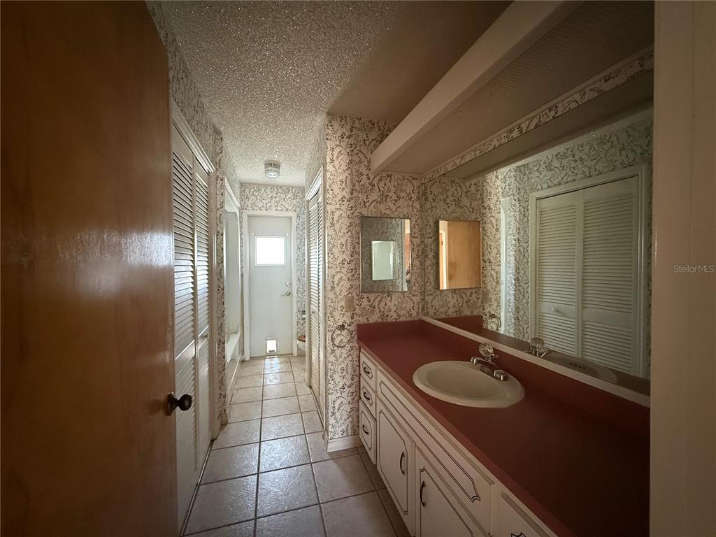 34847 Learn Road Leesburg, FL 34788 - Photo 21 of 25 a bathroom with a sink and a mirror