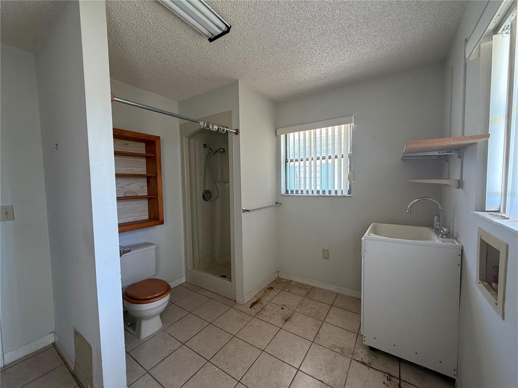34847 Learn Road Leesburg, FL 34788 - Photo 23 of 25 a bathroom with a toilet and a shower