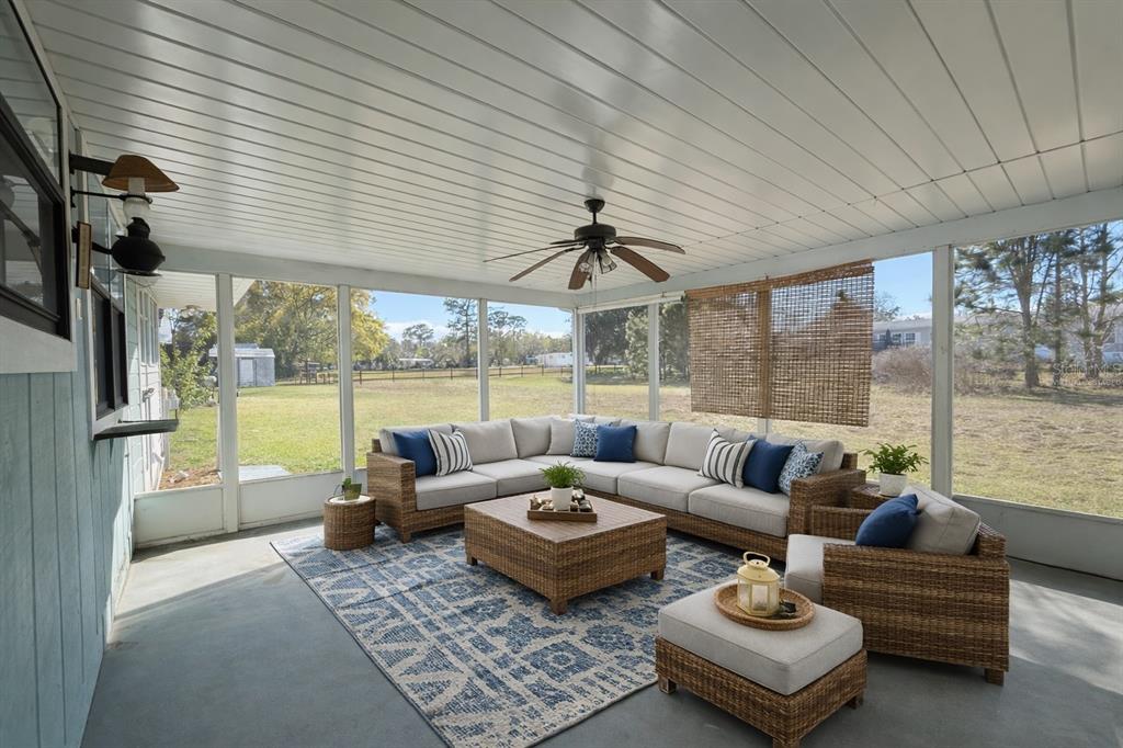 34847 Learn Road Leesburg, FL 34788 - Photo 24 of 25 a living room with furniture and a large window