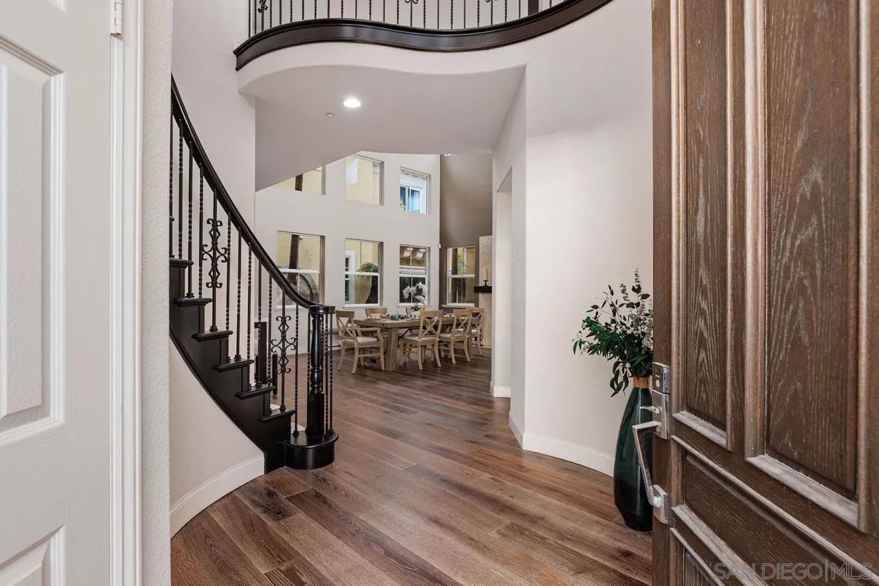 1460 Ravean Court Encinitas, CA 92024 - Photo 13 of 72 a view of entryway with wooden floor and stairs