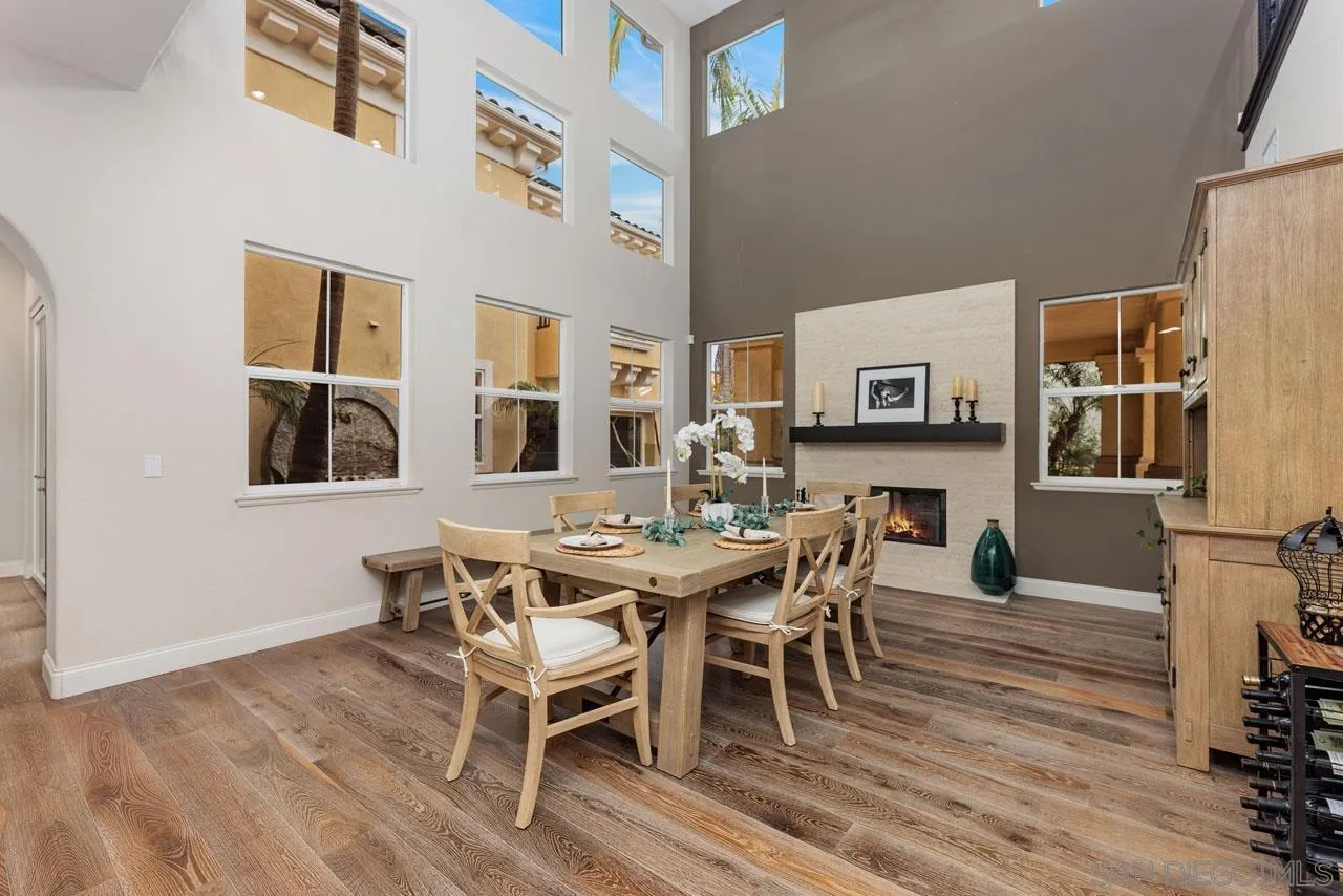1460 Ravean Court Encinitas, CA 92024 - Photo 15 of 72 a view of a dining room with furniture and wooden floor
