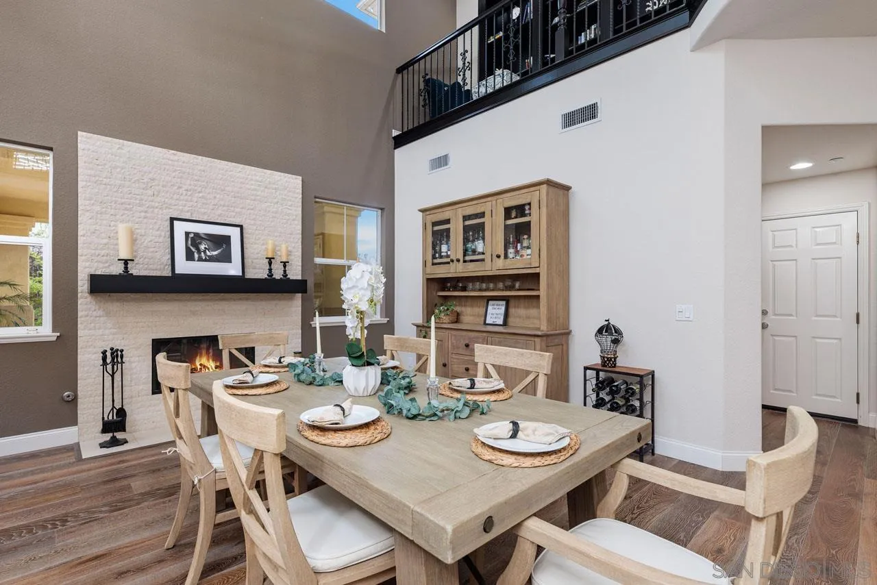 1460 Ravean Court Encinitas, CA 92024 - Photo 16 of 72 a dining room with furniture and wooden floor