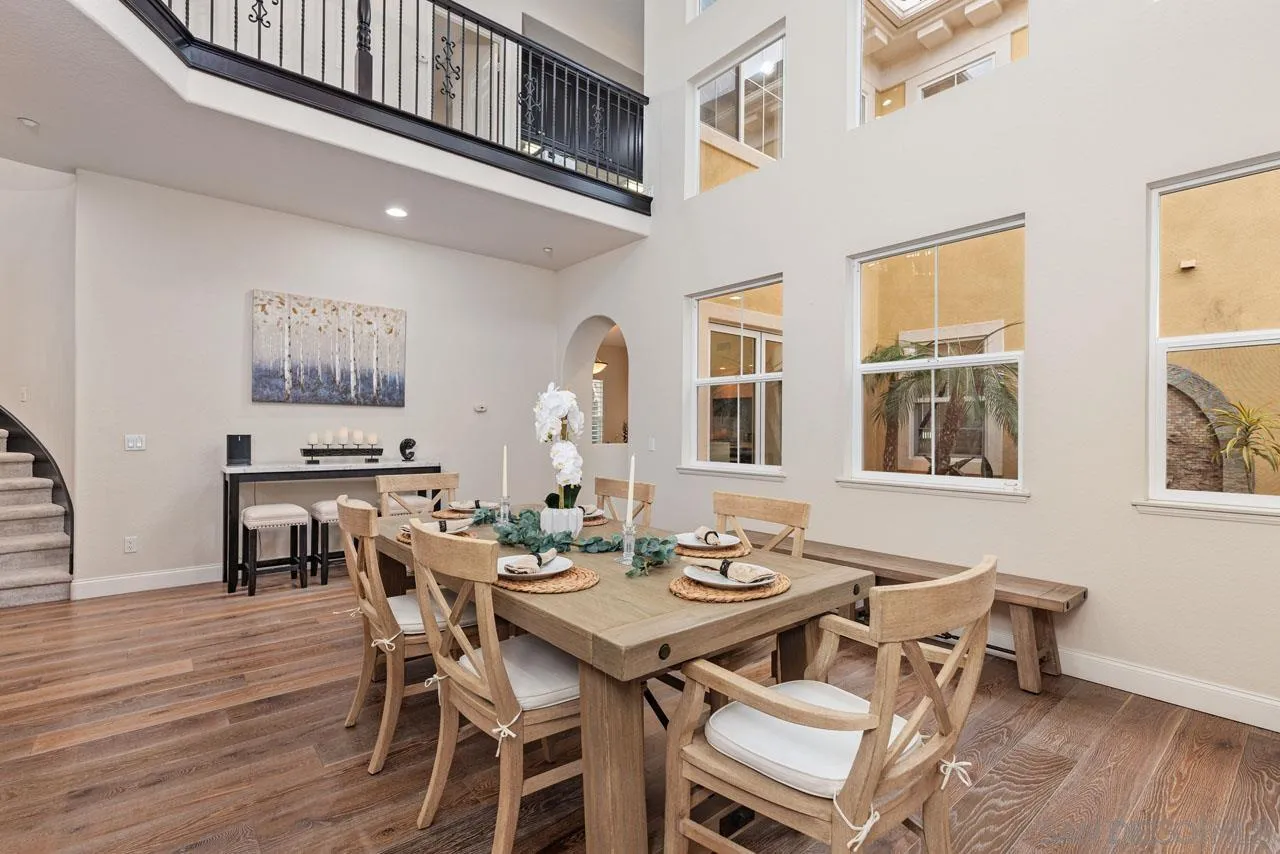 1460 Ravean Court Encinitas, CA 92024 - Photo 17 of 72 a view of a dining room with furniture and wooden floor