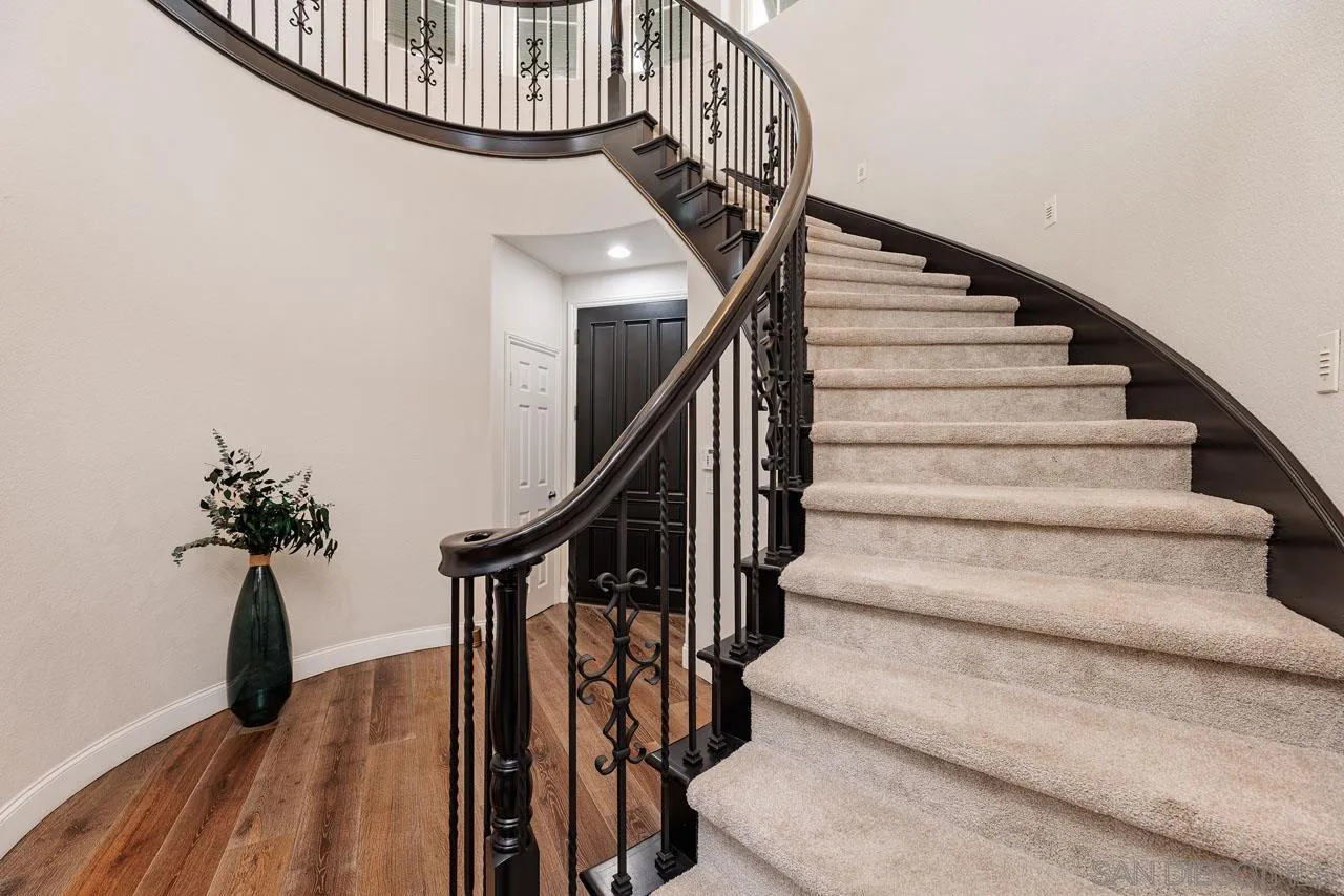 1460 Ravean Court Encinitas, CA 92024 - Photo 32 of 72 a view of entryway with wooden floor and stairs