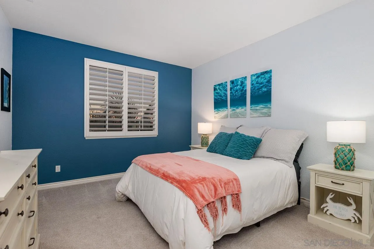 1460 Ravean Court Encinitas, CA 92024 - Photo 49 of 72 a bedroom with a bed and a window