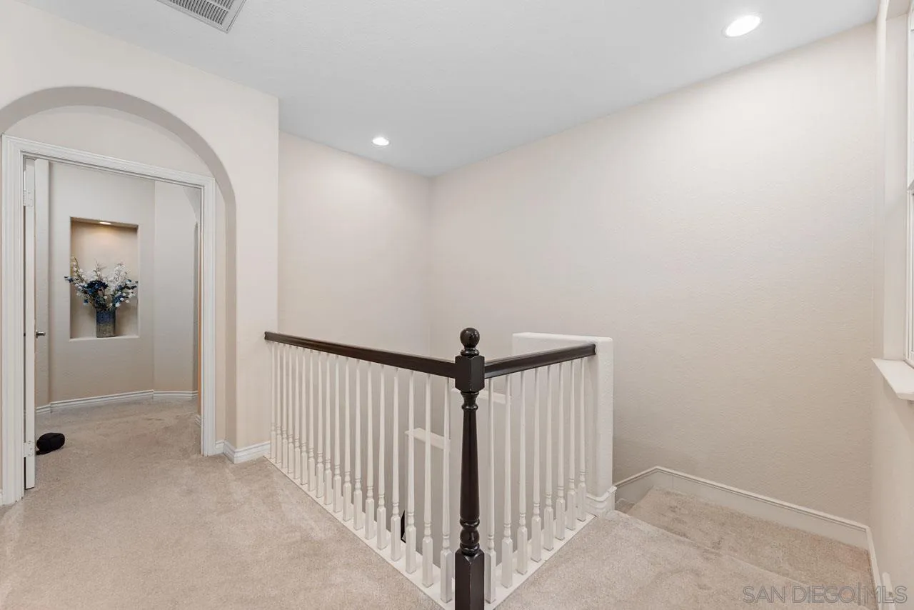 1460 Ravean Court Encinitas, CA 92024 - Photo 54 of 72 a view of a hallway with stairs
