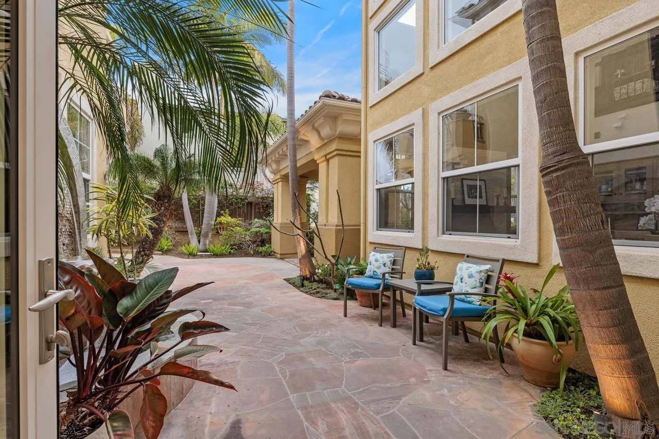 1460 Ravean Court Encinitas, CA 92024 - Photo 57 of 72 a backyard of a house with outdoor seating