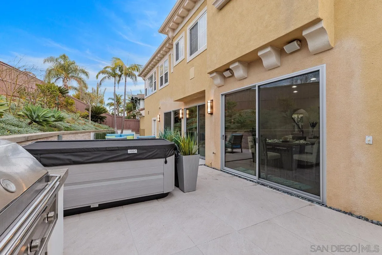 1460 Ravean Court Encinitas, CA 92024 - Photo 58 of 72 a view of backyard with wheel chair and potted plants