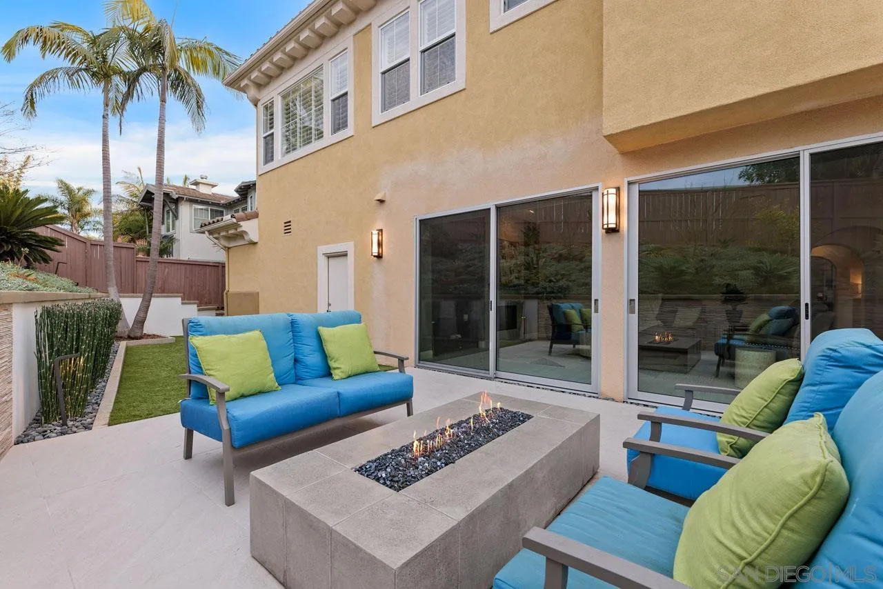 1460 Ravean Court Encinitas, CA 92024 - Photo 59 of 72 a view of a patio with couches and a table and chairs