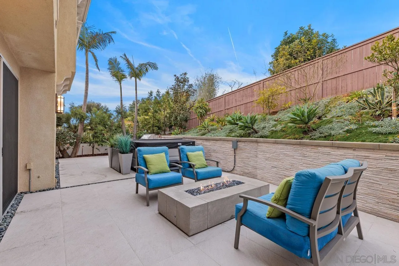1460 Ravean Court Encinitas, CA 92024 - Photo 60 of 72 a backyard of a house with table and chairs