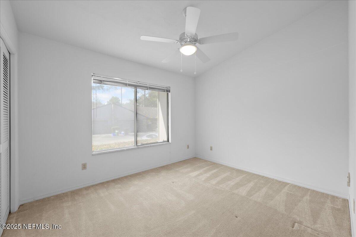 3726 Northwest 53rd Road Gainesville, FL 32653 - Photo 12 of 36 an empty room with a window