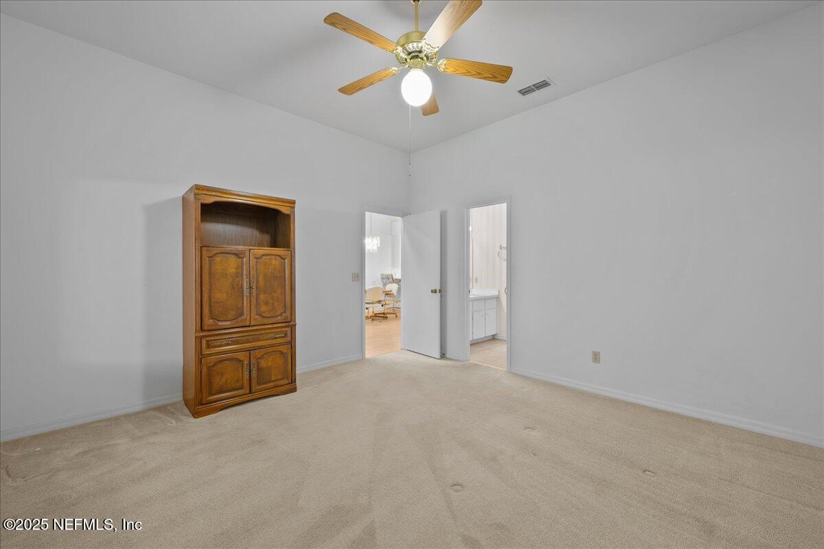 3726 Northwest 53rd Road Gainesville, FL 32653 - Photo 16 of 36 an empty room with closet and fan