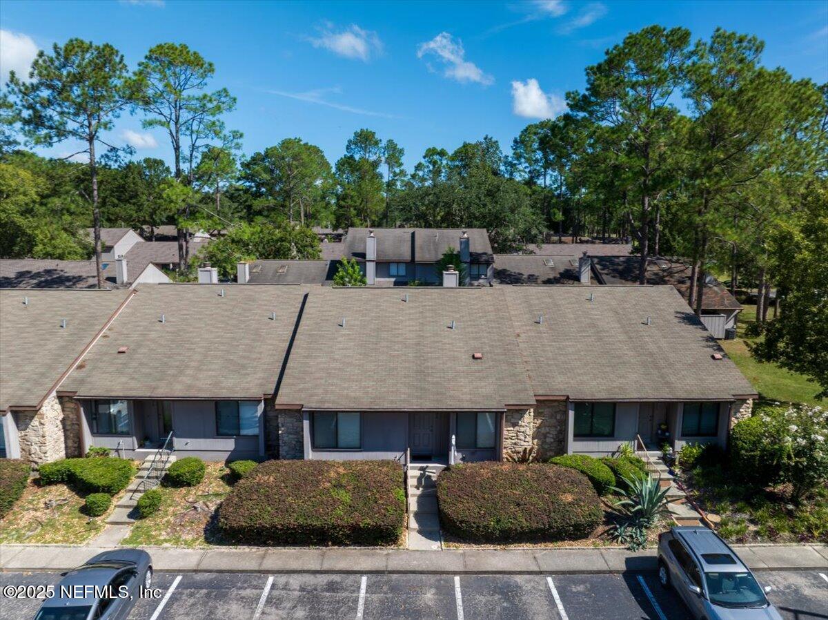 3726 Northwest 53rd Road Gainesville, FL 32653 - Photo 21 of 36 a aerial view of a house with swimming pool and furniture
