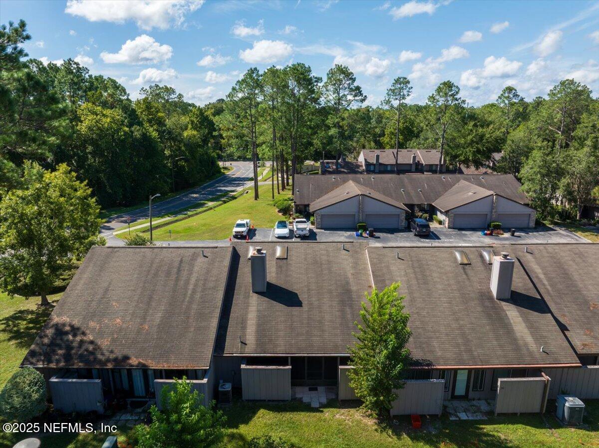3726 Northwest 53rd Road Gainesville, FL 32653 - Photo 22 of 36 an aerial view of a house with a swimming pool a yard and a fountain