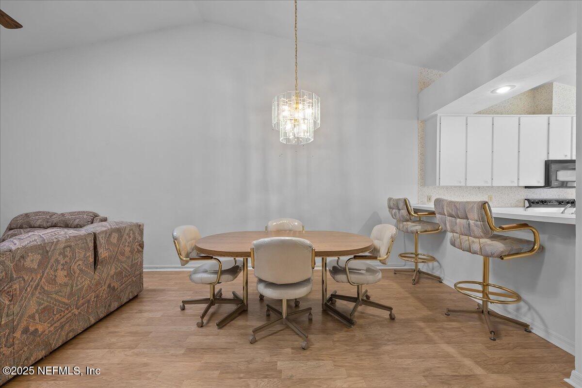 3726 Northwest 53rd Road Gainesville, FL 32653 - Photo 8 of 36 a view of a dining room with furniture and window