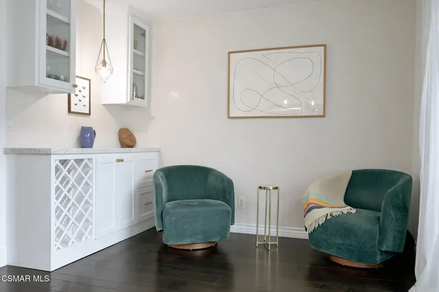 a living room with furniture and a chair