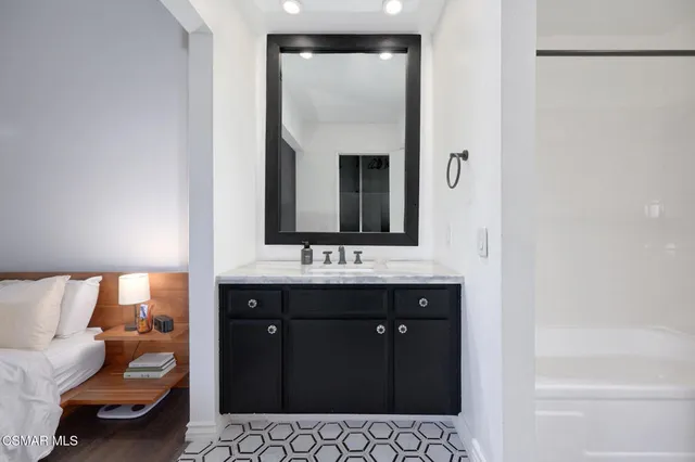 a bathroom with a sink and a mirror