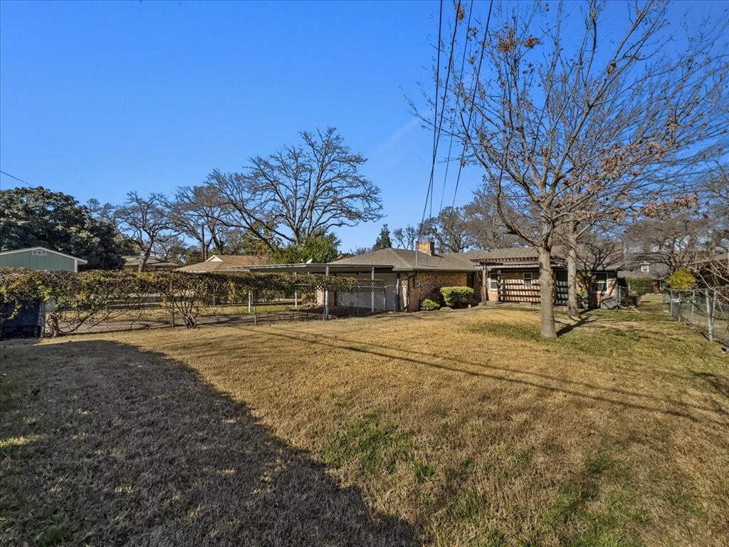 2709 Ripplewood Drive Dallas, TX 75228 - Photo 23 of 24 a front view of a house with a yard