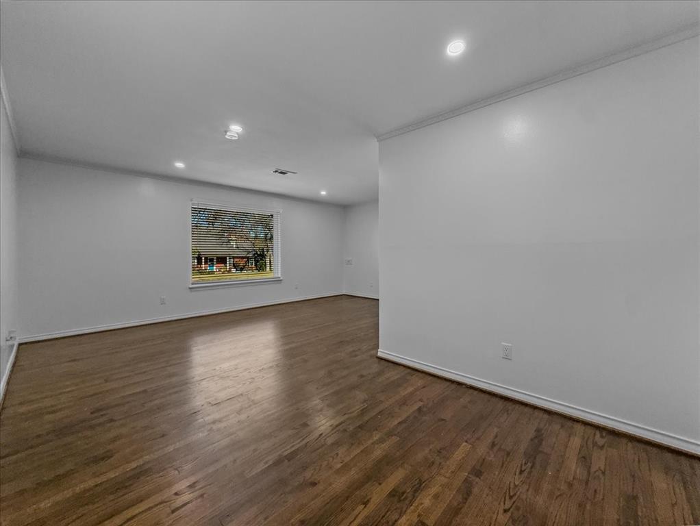 2709 Ripplewood Drive Dallas, TX 75228 - Photo 10 of 24 an empty room with wooden floor and windows