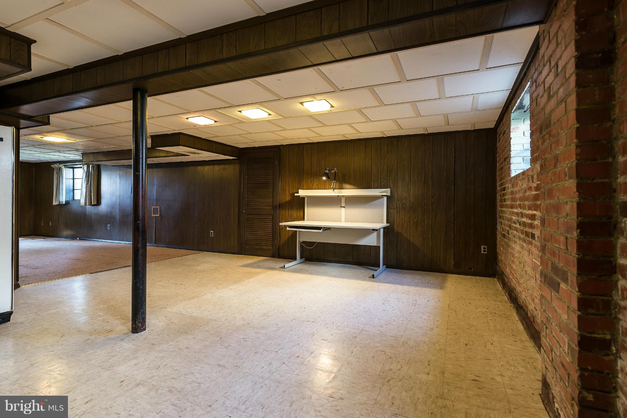 11809 Indigo Road Silver Spring, MD 20906 - Photo 23 of 30 a view of an empty room with a fireplace