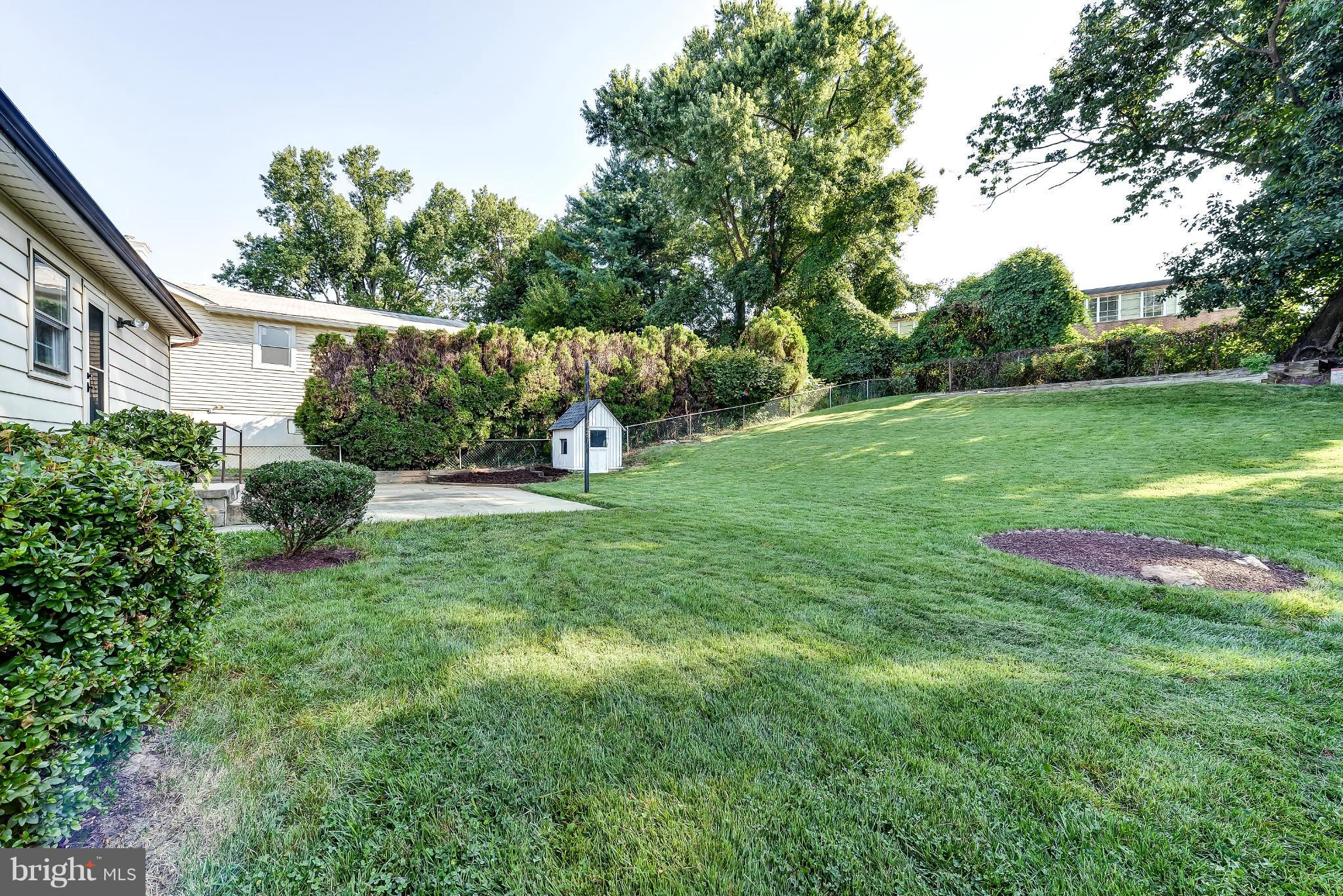 11809 Indigo Road Silver Spring, MD 20906 - Photo 30 of 30 a view of green field with trees in the background