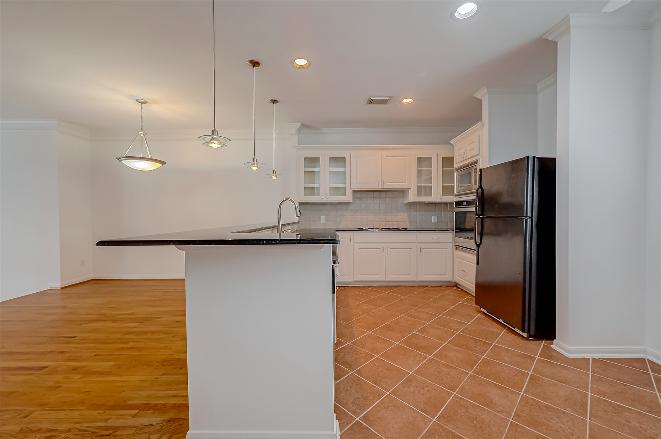 1507 Roy Street Houston, TX 77007 - Photo 11 of 20 a kitchen with stainless steel appliances granite countertop a refrigerator and a sink
