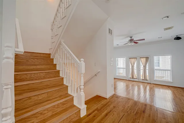 a view of entryway and hall with wooden floor