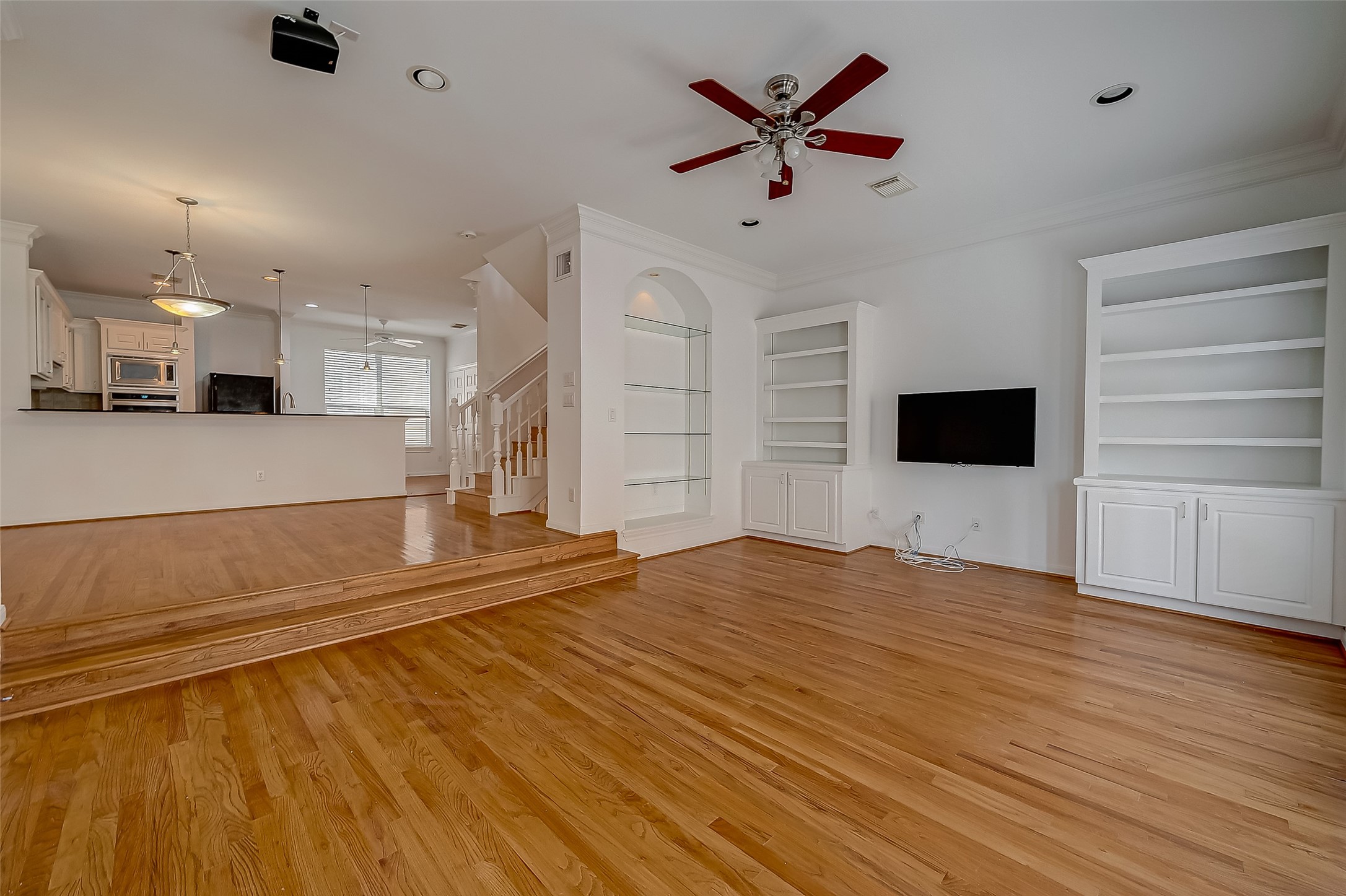 1507 Roy Street Houston, TX 77007 - Photo 6 of 20 a view of an empty room with kitchen and a window