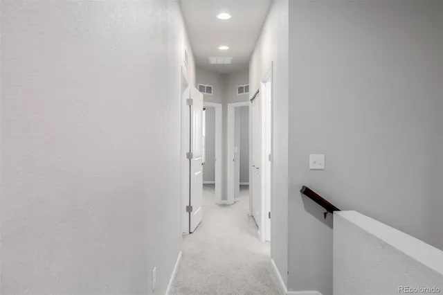 a view of a hallway with closet