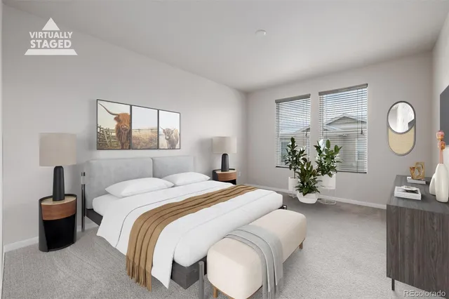 a bed room with a bed mirror and a window