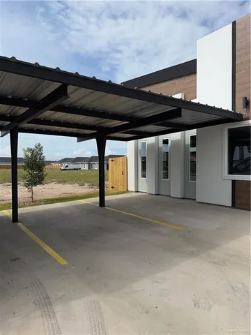 a kitchen with stainless steel appliances a stove and white cabinets