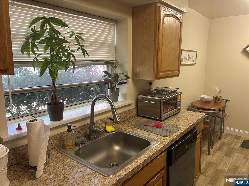 280-320 Oak Street, Unit 280A Ridgewood, NJ 07450 - Photo 3 of 24 a kitchen with a stove and a sink