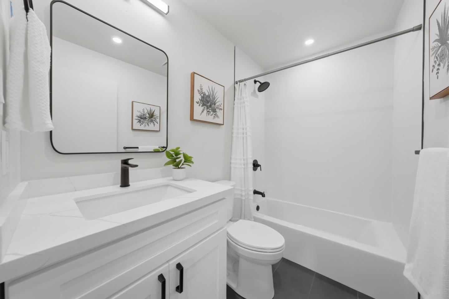 409 Puerto Place Hayward, CA 94541 - Photo 34 of 54 a bathroom with a sink a toilet and shower