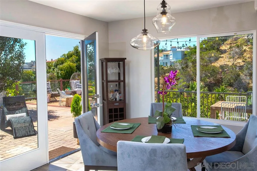 918 Sandpiper Place La Jolla, CA 92037 - Photo 6 of 25 a dining room with furniture a livingroom view and chandelier