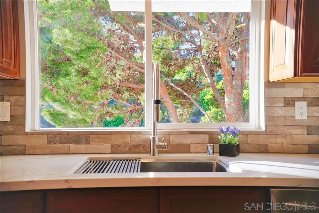 918 Sandpiper Place La Jolla, CA 92037 - Photo 10 of 25 a sink with a window and outdoor space