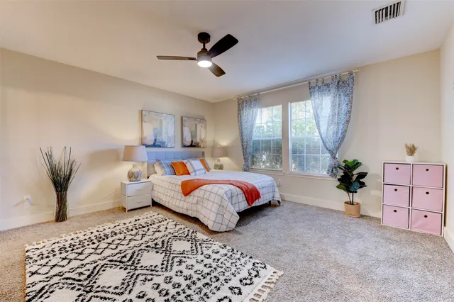 a bed room with a bed and a couch