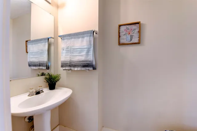 a white toilet sitting next to a small bathroom