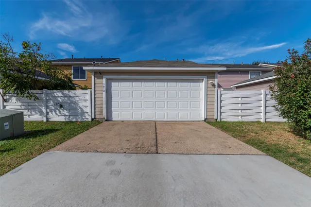 a view of a town with brick building and large trees