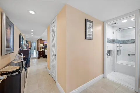 a view of a hallway with dining area