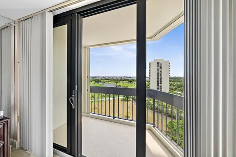 a view of a glass door with a outdoor from next door