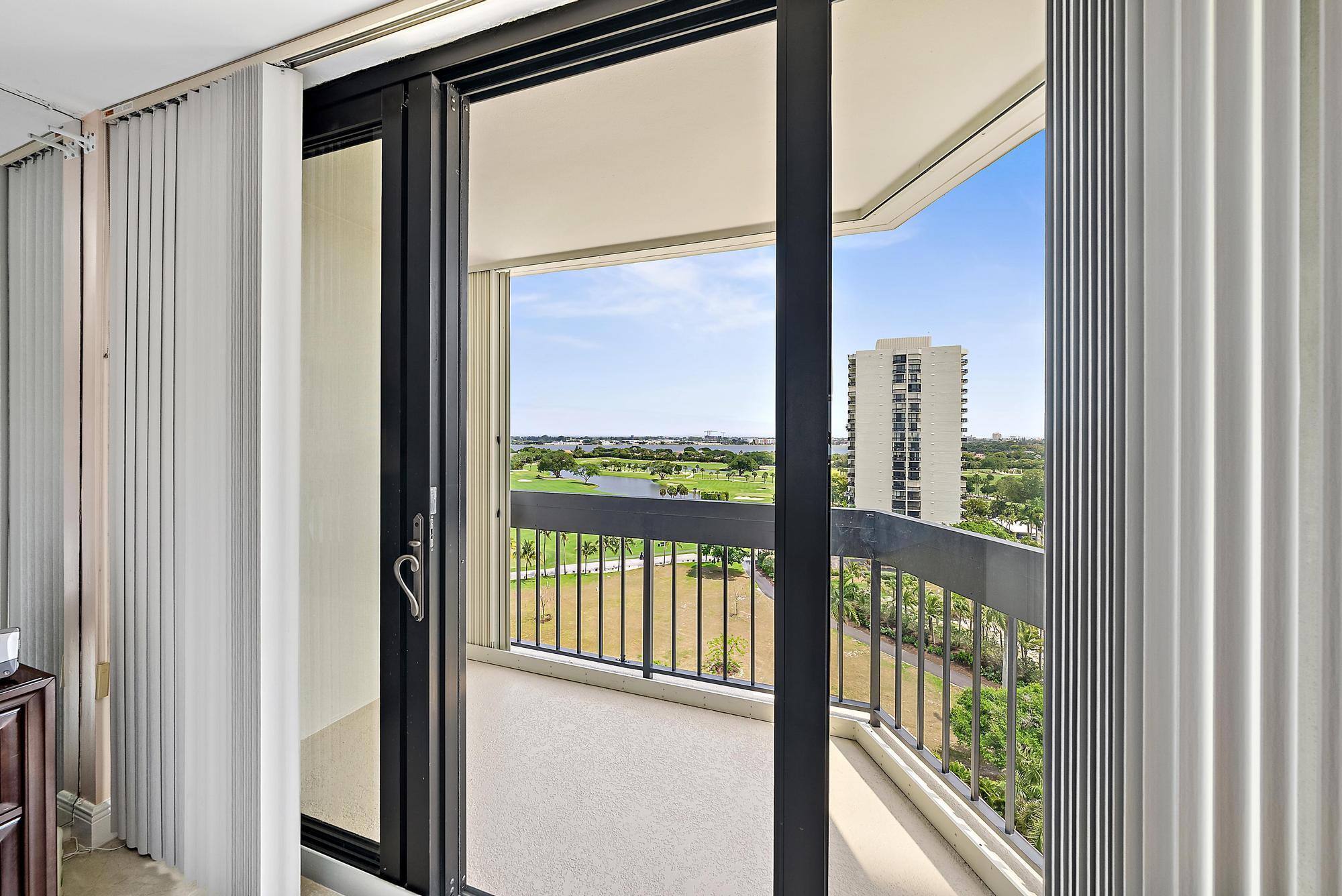 2400 Presidential Way, Unit 1204 West Palm Beach, FL 33401 - Photo 22 of 55 a view of a glass door with a outdoor from next door