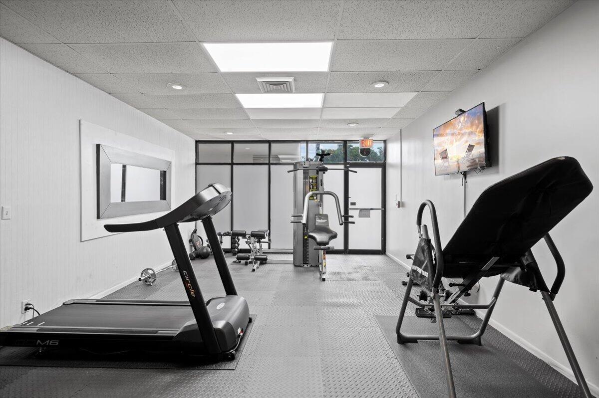 2400 Presidential Way, Unit 1204 West Palm Beach, FL 33401 - Photo 30 of 55 a view of a room with gym equipment