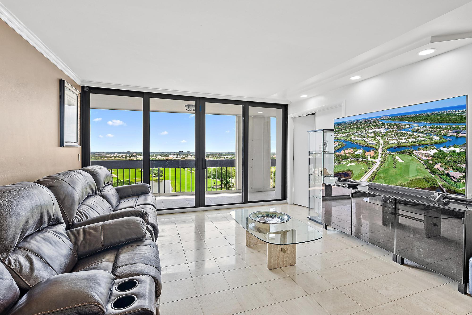 2400 Presidential Way, Unit 1204 West Palm Beach, FL 33401 - Photo 5 of 55 a living room with furniture and a large window