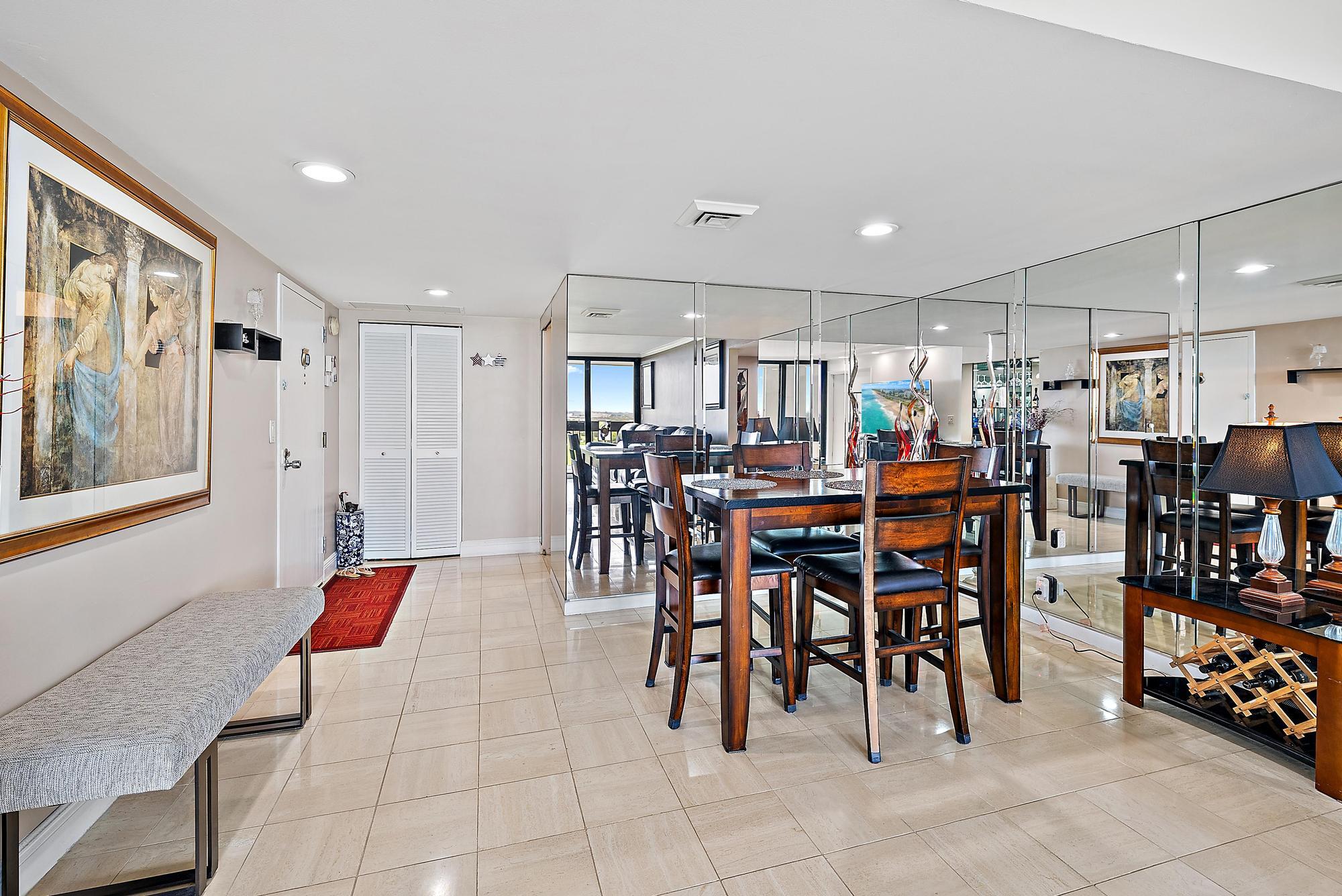 2400 Presidential Way, Unit 1204 West Palm Beach, FL 33401 - Photo 10 of 55 a view of a dining area with furniture