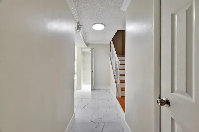 wooden floor in an empty room with a mirror