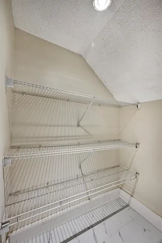 a view of a room with racks on the wall