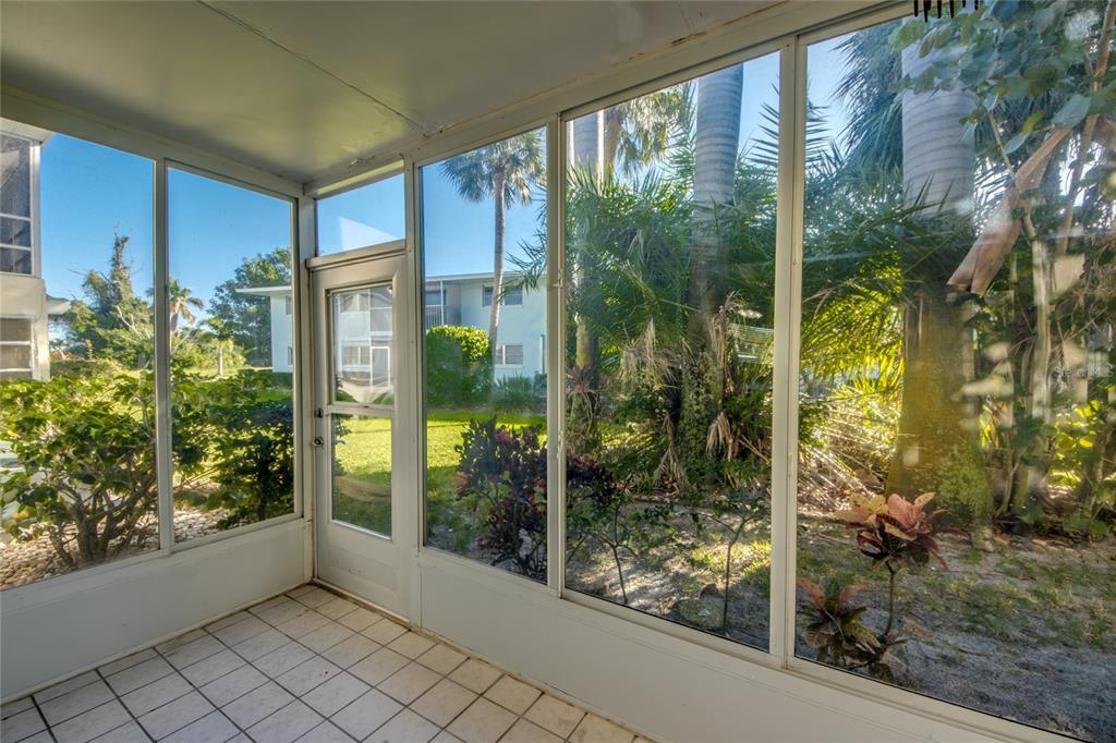 1003 Tropic Terrace North Fort Myers, FL 33903 - Photo 22 of 35 a view of a glass door and porch