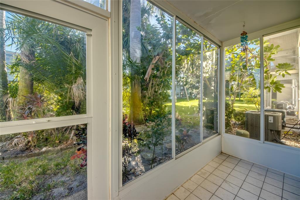 1003 Tropic Terrace North Fort Myers, FL 33903 - Photo 24 of 35 a view of a glass door and porch