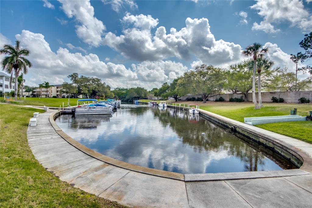 1003 Tropic Terrace North Fort Myers, FL 33903 - Photo 30 of 35 a view of a swimming pool with a yard and plants